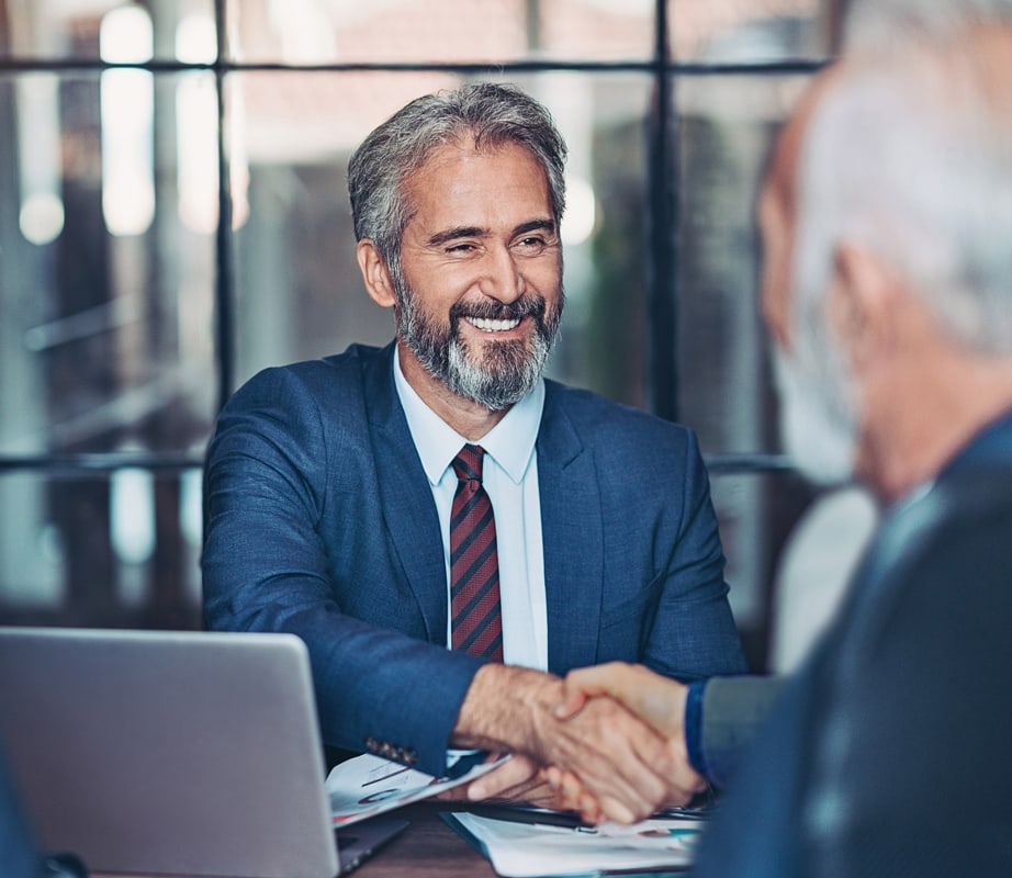 Lawyer shaking hands with client.